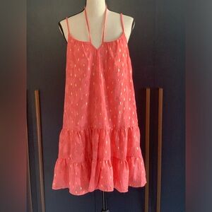 Coral dress with gold thread pattern.